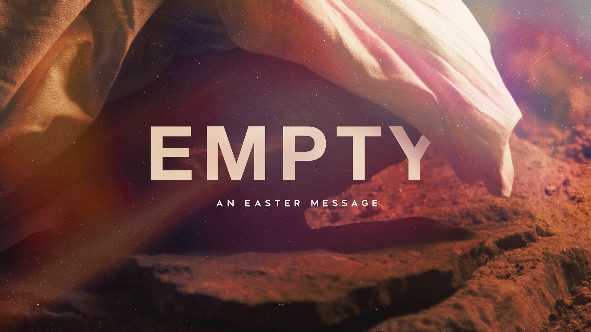 Sheet over rock, text "Empty An Easter Message"